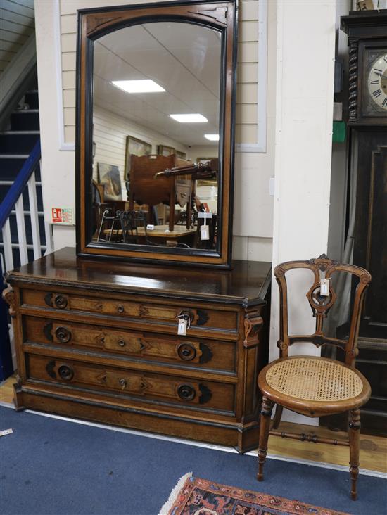 A Victorian ebonised and walnut chest, circa 1875, with matching wall mirror and side chair, Chest W.130cm, Mirror W.86cm